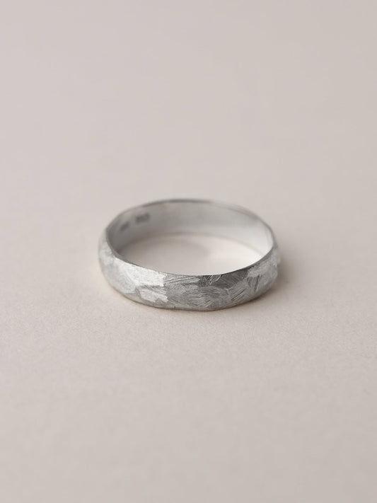 A pair of faceted wedding rings
