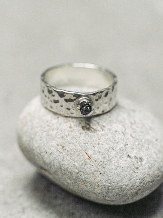 A wide ring with a diamond