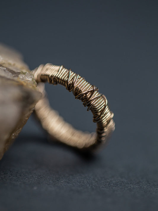 A pair of wedding rings wrapped in wire