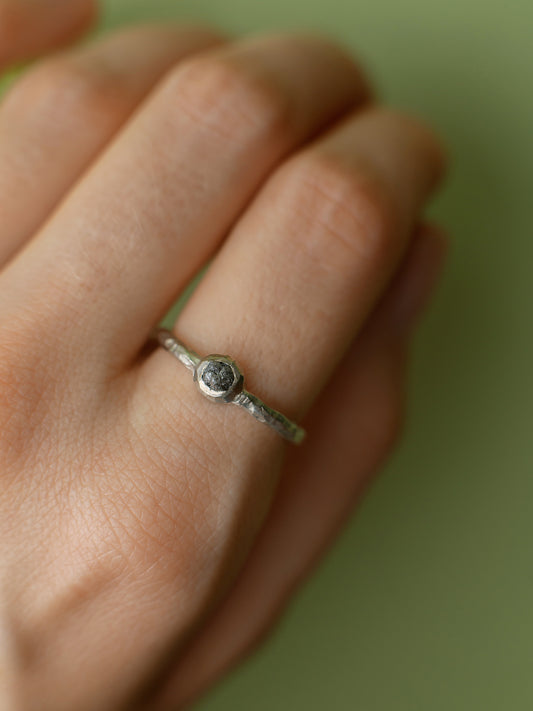 Thin forged ring with diamond
